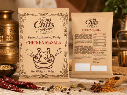 Two bags of Chits Masala Chicken Masala spice mix displayed on a rustic table with whole spices, dried red chilies, and brass utensils in the background.