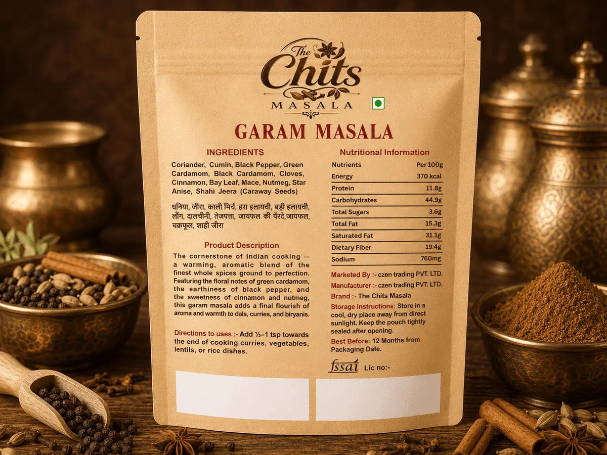 The back of a Garam Masala spice packet by Chit Chikita Masala, displayed against a warm, blurred background of whole spices.