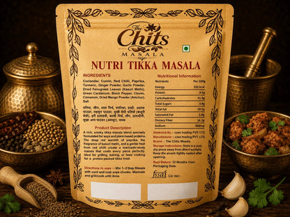A stand-up pouch of The Chits Masala Nutri Tikka Masala seasoning mix, shown against a styled background with brass utensils, garlic, and herbs. The front of the package features a warm tan design with black text and decorative borders.